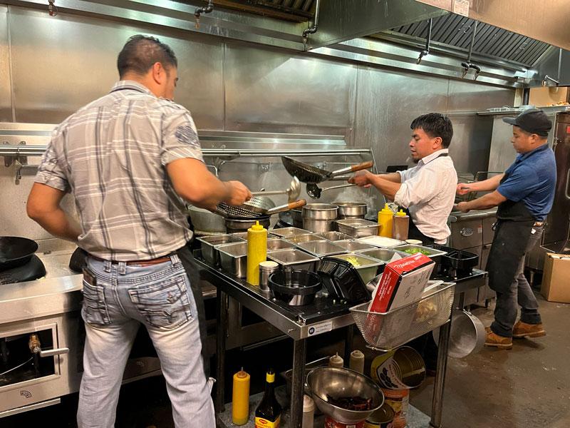  Working in the kitchen at Eggroll Express.