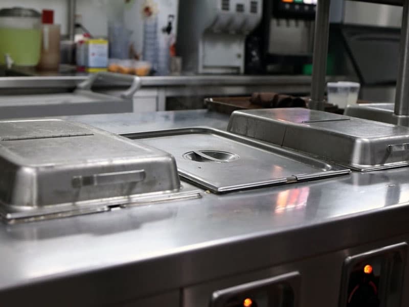 Steam table and steam pans ready to keep food warm.