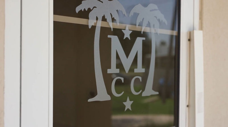 The McAllen Country Club logo on the door.