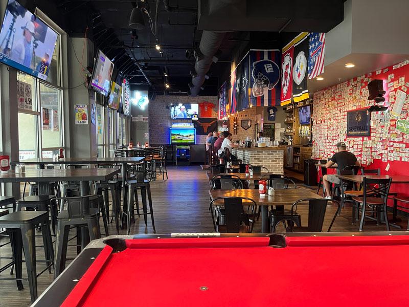 The dining area at Mad Hatter Neighborhood Pub in Richardson.