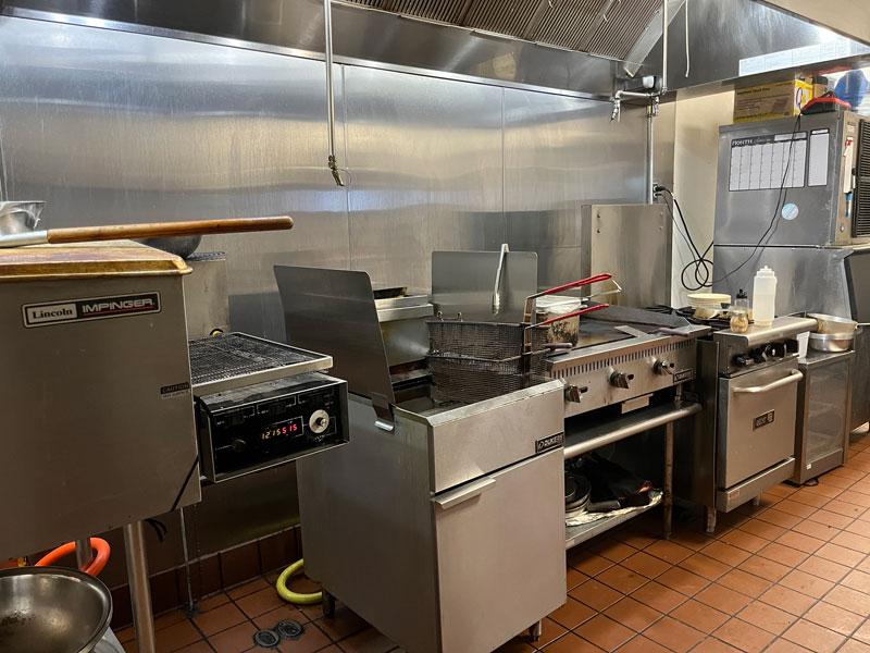 Bringing the heat in the kitchet at Mad Hatter Neighborhood Pub in Richardson.