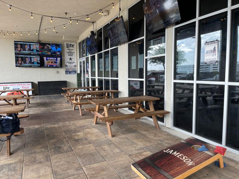 Outdoor dining at Mad Hatter Neighborhood Pub in Richardson.