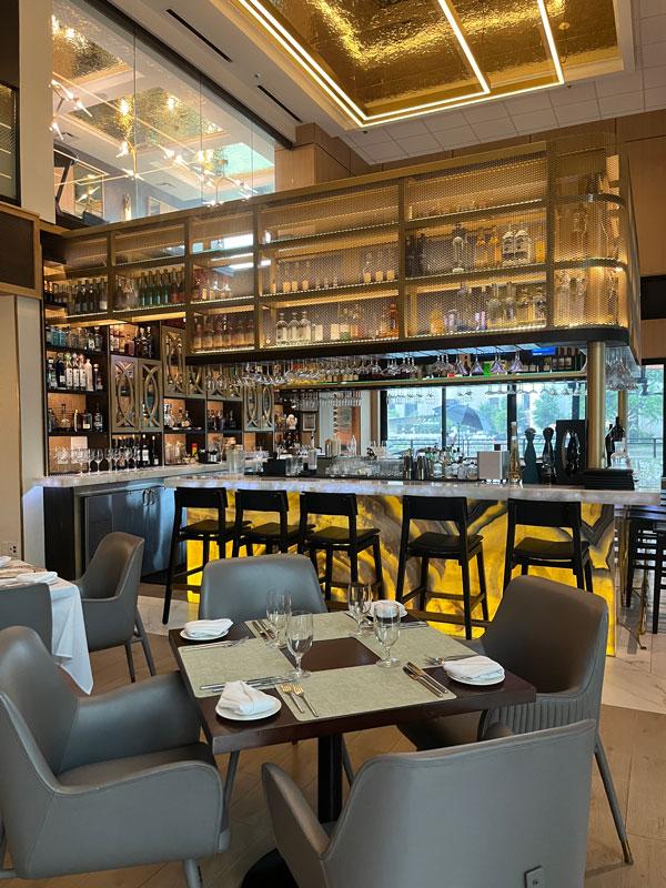 A view of the bar from the dining area at Sanjh Restaurant.