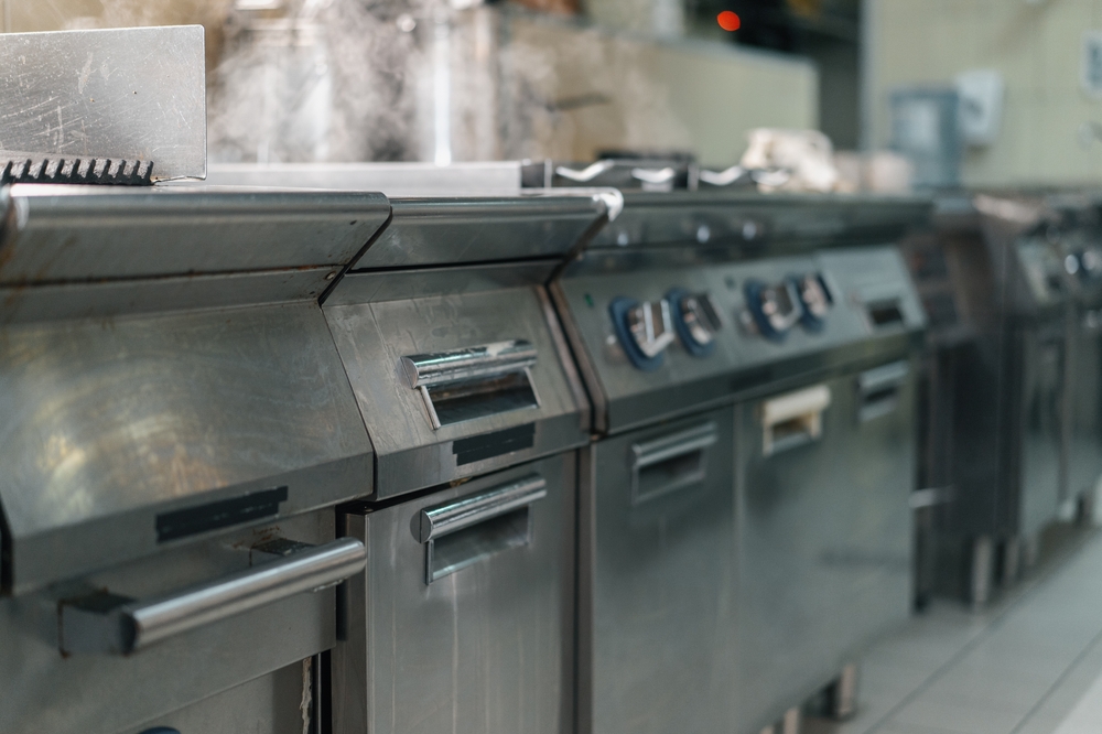 Kitchen equipment requirements being compared across commercial kitchen equipment, including access, capacity, utilities, and maintenance needs.